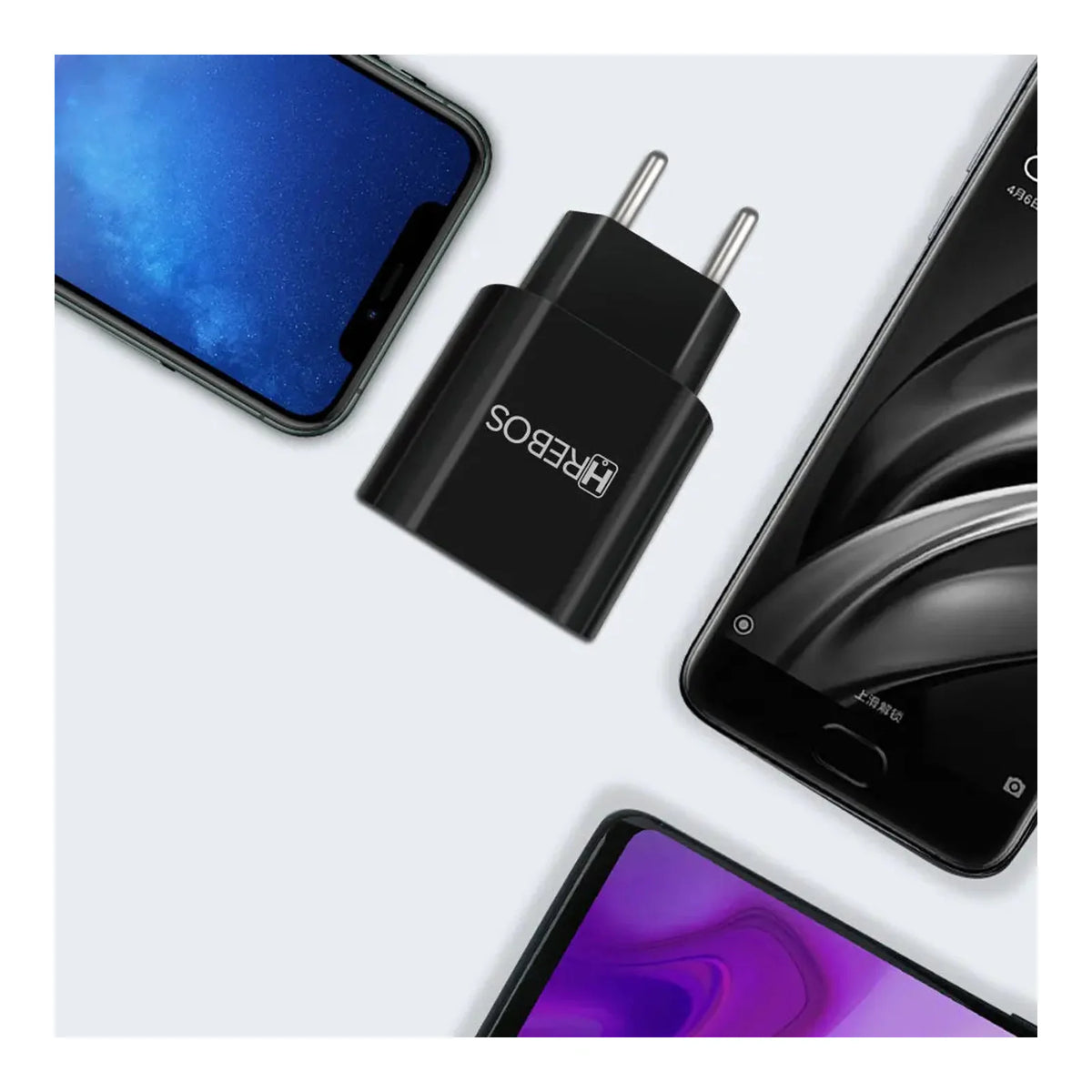 Fonte Carregadora Hrebos Power Duo CRG-397 preta entre smartphones