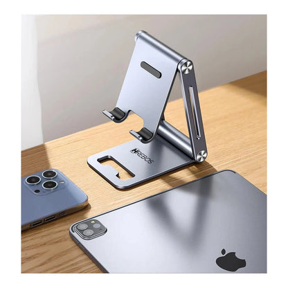 Suporte Hrebos Grip Mate Pro SU-249 cinza sobre uma mesa com celulares